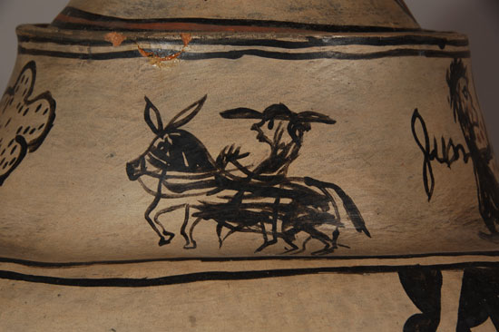 San Ildefonso Pictorial Lidded Jar, circa 1889 This is an intriguing storage jar that, based on the vessel shape, can be attributed either to Martina Vigil Montoya (1856-1916) or her mother, Toña Peña Vigil (b.1830).1 One need not guess the age of the jar as it prominently displays the year 1889 on the lid. Collection data that accompanies the jar in the form of a hand-written letter from a Mrs. L. Wills states that it was purchased in 1901 in Santa Fe. The text of the letter, written on stationary from Hotel Corinado in Trinidad, Colorado, follows: Indian Jug Oylla. This said Oylla purchased in Santa Fe New Mexico and expressed to Mrs. L. Wills, Trinidad, Colo. 1901 by Miss Susie Gilchreest Chicago Ill – on her first trip west as a demonstrator for Sprague Warner – She misrouted it & one year later Mrs Wills read list of unclaimed Exp in Denver & found to be the investment of Miss Gilchreest sent Mrs. L. Wills – In 1901 it was claimed to her there were but three of this size “oylla” in U.S. and they were $100.00 each. (Signed) Mrs L Wills— Even more intriguing is the pictorial story portrayed on the vessel in the area of the neck. There are three pictorial frames: One frame illustrates a man holding the reins of a horse while the two are running—the man behind the horse as if being pulled along, his hat falling from his head. A second frame shows a man riding a horse, who appears to be wearing the hat of the style often seen on priests of the time period. The third frame shows two men fighting each other—one possibly with a club and the other with a knife. One of these men is named Juan and the other Jose. On the handle of the lid is written the name Juan on one side and 1889 on the other side. The rest of the story is speculation. Does Juan’s name on the lid indicate that he was the winner of the fight and the jar was made in his honor, or does it indicate he was the loser of the fight and the jar was made as a memorial? Was the man behind the horse trying to capture a runaway horse or was he attempting to steal the other man’s horse? Was the man with the padre-like hat a Franciscan and, if so, what was his part in this story? There are a couple clues as to some of the persons involved. Juan Arquero Vigil, originally from Cochiti Pueblo, was the husband of Toña Peña Vigil, who was the mother of Martina Vigil Montoya. Either potter could have made the jar – Toña for her husband, Martina for her father. If Toña made the jar in 1889, she would have been approximately 60 years old. If Martina made the jar at that time, she would have been 33 years old. Both women were probably actively involved in pottery production in 1889. 1Personal Conversation with Jonathan Batkin 2001.