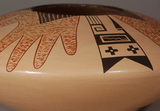 Hopi Polychrome Seed Jar with Ancestral Design This is an absolutely spectacular Hopi seed jar with designs reminiscent of ancestral Hopi potters. The “hand” design has been used in prehistoric pottery. The potter did not apply a slip to the vessel, but stone-polished the natural clay body before applying the painted design, which is flawless. Agnes Nahsonhoya is a daughter of Pauline Setalla and niece of Eunice Navasie. She has been an active potter since 1975 and is extraordinarily talented. Her vessel walls are thin; her burnishing is smooth and her painting of designs is flawless. Condition: This seed jar was purchased by the previous owners in either 1989 or 1990 and it is in original excellent condition. Provenance: ex.coll. Tulsa, OK pottery collectors Recommended Reading: There is a biographical statement by the artist in Hopi-Tewa Pottery 500 Artist Biographies by Gregory Schaaf.