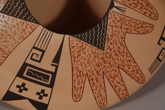 Hopi Polychrome Seed Jar with Ancestral Design This is an absolutely spectacular Hopi seed jar with designs reminiscent of ancestral Hopi potters. The “hand” design has been used in prehistoric pottery. The potter did not apply a slip to the vessel, but stone-polished the natural clay body before applying the painted design, which is flawless. Agnes Nahsonhoya is a daughter of Pauline Setalla and niece of Eunice Navasie. She has been an active potter since 1975 and is extraordinarily talented. Her vessel walls are thin; her burnishing is smooth and her painting of designs is flawless. Condition: This seed jar was purchased by the previous owners in either 1989 or 1990 and it is in original excellent condition. Provenance: ex.coll. Tulsa, OK pottery collectors Recommended Reading: There is a biographical statement by the artist in Hopi-Tewa Pottery 500 Artist Biographies by Gregory Schaaf.