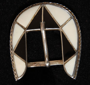 Zuni Mother of Pearl and Jet Inlay Ranger Set Southwest Indian Jewelry Belts and Buckles Zuni Pueblo This Zuni ranger set is inlayed in stark black and white using jet and mother of pearl. The stones are set in silver channels and are precise in size and cut. The bezels around the stones are surrounded with twisted silver wire as additional decoration. The set is not signed by an artist. It appears to be mid-20th century but could be later. Condition: the set is in excellent condition Provenance: from a gentleman in Illinois Recommended Reading: Zuni Jewelry by Theda and Michael Bassman