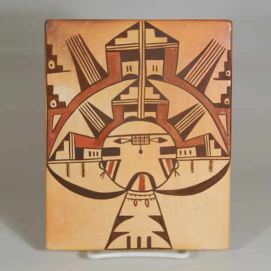 Tiles have been a popular collector's item for over a hundred years. The Hopi-Tewa potters have always been more prolific than the Rio Grande Pueblos in making them. Sadie Adams was very adept at making them and she made some of the largest tiles ever made. This tile is a good example of her large ones. It features a design that incorporates a portion of the Salakomana Katsina and its elaborate headdress.   It is signed with one of her flower hallmarks: Sadie Adams (1905-1995) Flower Woman (click here for her biography and examples of her hallmark signatures)