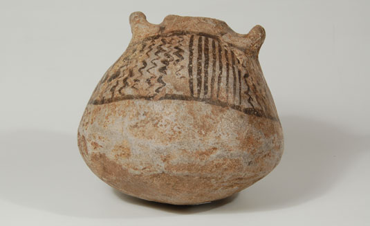 Pre-historic pottery from before 1600 has been excavated and is known as Jemez Black-on-white.  Pottery of that period has simple black designs over white slip as in this jar/canteen.