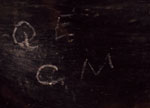 The initials Q. E. and C. M. were painted on the sidewall with matte black pigment.  