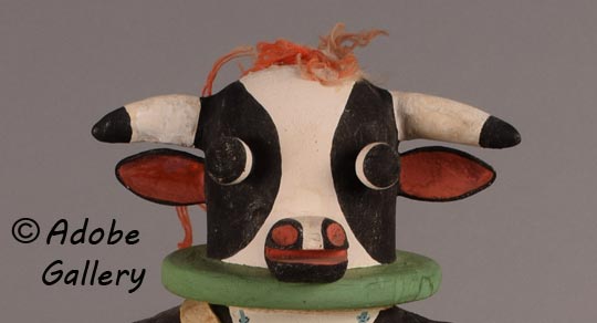 Close up view of the head of this cow kachina doll.