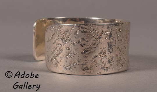 Alternate side view of this silver bracelet. 