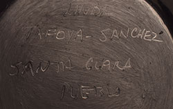 Artist signature of Linda Tafoya-Sanchez (1962 - ) Santa Clara Pueblo