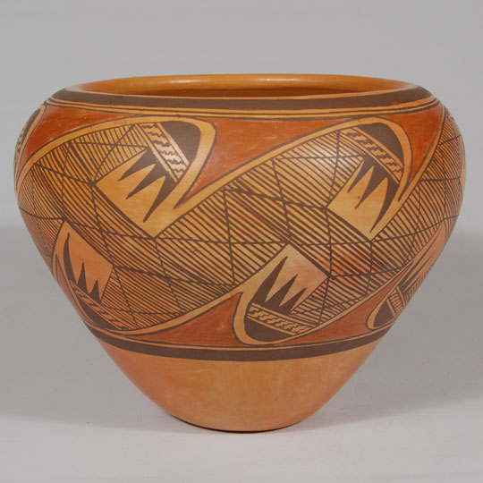 This is an extraordinary piece of pottery by Priscilla Nampeyo. It is beautifully formed, using native clay and the coiling technique. A strong decoration consists solely of the traditional Sikyatki-inspired migration pattern starting at the rim and flowing downward to near the base. It has been stated that this pattern reflects the migration of the Hopi through four worlds to this current one.   The jar is signed Priscilla Namingha, a signature, I believe, she used into the 1980s, after which she added Nampeyo to her name.  There is a wonderful interview of Priscilla Nampeyo by Greg Schaaf in his book Hopi-Tewa Pottery 500 Artist Biographies.    Condition: The jar is in original excellent condition Provenance: ex. coll. Frances Sonnenberg, Santa Fe resident