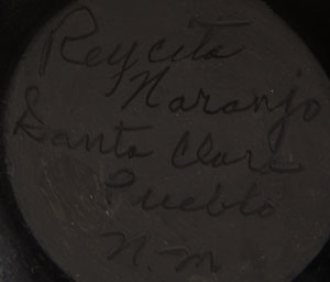 The potter, Reycita Naranjo, who made this deep bowl, is one of a large family of potters, all of whom are exceptional artists.  Her sisters, Clara Shije, Elizabeth Naranjo, Florence Browning, Mary Singer, and Mary Carlisle all are recognized as outstanding potters.  One look at this beautifully deep dish with a carved Avanyu design filling the interior of the bowl verifies the exceptional talent of the potter.  Reycita has been an award winner at Santa Fe Indian Market since 1981 to the present. She has been featured in numerous publications as well.  Condition:  The bowl is in original excellent condition  Provenance:  ex.coll. Tulsa, OK pottery collectors  Recommended Reading: Santa Clara Pottery Today by Betty LeFree 