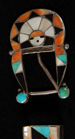 Zuni multicolor inlay is an extremely popular expression of Zuni art. The rainbow of colors used is derived from specially cut pieces of turquoise, spondylus, jet and mother-of-pearl. Each of these has meaning in the Zuni religion.  Each stone is cut and meticulously set in mosaic style within silver channels and secured with a silver bezel. Although the artisan did not sign the piece, it is obvious that it was one of the finer lapidary artisans at Zuni.  It appears that this is a first half of the 20th century set.  I doubt seriously that is was made after 1950.  All it needs is a belt. Condition:  the set is in excellent condition Provenance: from a gentleman in Florida Recommended Reading: Zuni Jewelry by Theda and Michael Bassman 