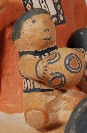 This charming small male storyteller figurine was made by Buffy Cordero, granddaughter of famed potter, Helen Cordero.  Two children cling to the adult’s head, two rest on his lap, one of which is holding a ball, and one clings to the back of his shirt.  Buffy is the daughter of Helen’s son, George, and she was taught pottery making by her grandmother and her dad.  Condition: appears to be in original condition  Provenance: from the collection of Katherine H. Rust  Recommended Reading: The Pueblo Storyteller by Barbara Babcock 