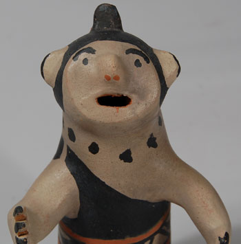 Damacia Cordero was a legend from Cochiti Pueblo. Her storyteller figurines and animal creations were unlike any other potter's work. This female figurine has the elongated torso, short legs, big ears, protruding nose and flat face of her traditional style.  Touches of red paint were used for the mouths and nostrils and for the belt and the chonga hairstyle. The figurine is not signed but there is no doubt as to the artist, as no other potter copied her work.   Condition:  the figurine is in original condition.  I would estimate it to date to the decade of the 1970s.  Provenance: from the collection of Katherine H. Rust   Recommended Reading: The Pueblo Storyteller by Barbara A. Babcock 