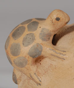 This canteen sits so the spout is up at an angle to prevent water spillage from the neck.  On its back ride a lizard and a turtle, both heading toward the spout for a drink.  Traditional Cochiti Pueblo rain cloud symbols are painted on the surface.    Condition:  The canteen is in original excellent condition.  Provenance: from the collection of Katherine H. Rust.  The canteen was probably a gift from the potter to Mrs. Rust from one of her many Pueblo friends which is a reason that it is not signed. 