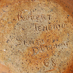 Robert Tenorio, early in his career, made stoneware vessels.  At some time later he switched to making traditional coiled pottery of Kewa Pueblo.  His stoneware vessels are relatively rare.  This bowl is signed and dated 1968.  On the interior, Tenorio carved three frogs into the clay and toned them brown on the mottled yellow background wall.  On the exterior, he carved birds into the clay and highlighted parts of them in dark brown on the light brown background.  In Kewa Pueblo tradition, he painted the rim black and incised a framing line just below the rim.  Condition:  the bowl is in original condition.  Provenance: from the collection of Katherine H. Rust 