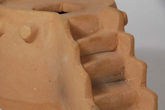 Although this clay replica of a pueblo kiva is not signed by an artist, we have attributed it to an unknown potter from Ohkay Owingeh Pueblo based on the appearance of the clay.  The tan clay is not stone polished but left in the natural matte finish.  The underside is slipped in red clay and stone polished.  It is estimated that the kiva was made in the 1960s, based on the collection from which it came.  Condition:  very good condition.  There is no visible damage  Provenance: from the collection of Katherine H. Rust 