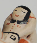 Ada Suina has always been recognized as one of the premier storyteller figurine potters. Her male figurines, such as this one, have a strong, chiseled face, and the children have happy carefree expressions. She still uses all natural materials and fires the figurines outdoors in the traditional manner.  Ada resumed making pottery figurines a few years ago after several years of not doing so following the death of her husband.  She relied so much on his help in digging the clay and working it to a point where she could form the figurines. Now, at age 83, she has to do everything by herself, therefore it is taking significantly more time to complete a piece. She is not very actively making pottery at this time.  This figurine is an older one of hers, probably more than 10 years old, but is in original condition.  It is an excellent example of her work.  The male has his mouth open telling stories to the children on his lap.  He is dressed in his finest traditional clothing and has a red headband over his hair.  All three children are boys.    Condition: original condition Provenance: from a gentleman from Colorado Recommended Reading:  The Pueblo Storyteller: Development of a Figurative Ceramic Tradition by Barbara Babcock, et al. 