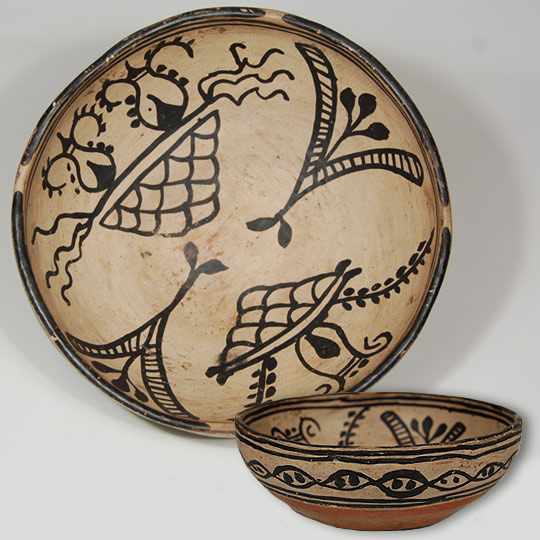 This is an extraordinarily beautiful polychrome bowl of traditional characteristics from Tesuque Pueblo.  It was exhibited in Adobe Gallery Tesuque show in 2002.  The paste is typically Tesuque in consistency-tan in color and fibrous in texture.  The un-slipped tan underbody exhibits the bumpiness characteristic of Tesuque pottery.  The bottom is rounded or slightly domed and features an extraordinary fire cloud.   The double pairs of framing lines do not contain ceremonial breaks, following a tradition at Tesuque dating back more than 200 years.  The black rim, however, contains four line breaks, probably not ceremonial in intent, but perhaps a decorative experiment.   This bowl is classed as polychrome solely on the red band on the underside.  There is no red elsewhere in the decoration.  Rain clouds, lightning, seed pods, and floral elements predominate the interior design.  A chain-like band encircles the exterior in typical Tesuque fashion.  The bowl dates to circa 1880.   Condition: excellent condition Provenance:  the bowl formerly was in the personal collection of Richard M. Howard, Santa Fe dealer and collector.  It was purchased from him in 2002 and exhibited in the Tesuque Pueblo pottery exhibit at Adobe Gallery, then sold to a client during the exhibit.  It is now available from that client. Recommended Reading: Tesuque: Place of the Red Willow, August 9-31, 2002, Adobe Gallery exhibit. 