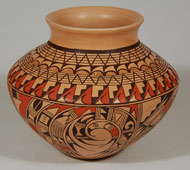 Roberta Youvella Silas was born in 1939 and began making pottery in 1965. She was the daughter of Pauline Youvella (Laguna Pueblo) and Roy Youvella (Hopi-Tewa). No one in her family made pottery, so she learned to do so by working with Helen Naha (Feather Woman).   Silas lived in the village of Polacca at First Mesa, where she was able to see many examples of ancient Sikyatki pottery in the form of pot shards. She incorporated the ancient pottery designs from these shards into her work.  Several potters of Hopi-Tewa lineage developed a wonderful design concept that is in variance with the more traditional Sikyatki-revival designs used by the Nampeyo family, yet it is based on the same origin. Roberta Silas was one of these who mastered the design concept.   This is an extremely well made medium-sized jar. It is nicely formed and painted with a precise hand. The ancient Sikyatki designs are a reminder of the continuity of pottery making on the Hopi mesas. It is signed by the potter on the bottom as follows: Roberta Youvella Silas Laguna Tewa.  Silas was proud that she had connections to two pueblos and illustrated this by signing both names on her pottery.   Condition: original condition Provenance: from the collection of a gentleman from New Jersey