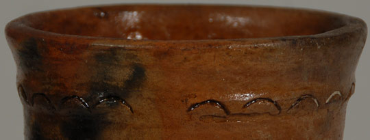 close up of break in the pottery design 