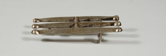 Tufa casting - sand casting - one of the earliest techniques used by Navajo smiths; beautiful belt buckle is simple with three long triangular bars and round tips