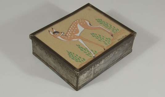 An original painting of a fawn by Navajo artist Harrison Begay was inserted under glass on the box lid.