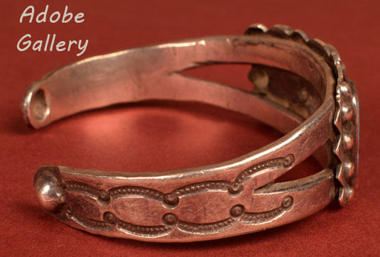 Alternate side view of this bracelet showing metalwork designs.