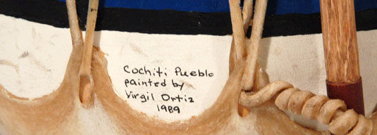 This drum was obviously new at the time we first sold it in 1989 and we were probably not impressed at that time by the note written in ink on the drum that states “Cochiti Pueblo painted by Virgil Ortiz, 1989.”  Virgil was 20 years old at that time and had not established himself as the artist he has become.  To us, he was probably just the son of Seferina Ortiz, a potter from whom we purchased storyteller figurines and nacimientos.  How things have changed.