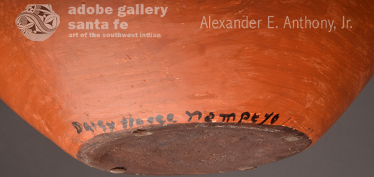 The jar is Hopi in style except for Daisy’s tribute to her Zuni life.  She painted the base of the jar, which is not visible unless turned over, a dark  brown as seen on all Zuni traditional pottery.  She signed the jar on the side at the base.