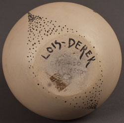 Signatures of Lois and Derek de la Cruz, Santa Clara Pueblo Potters