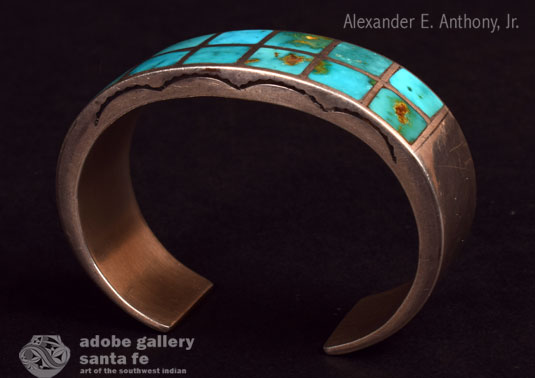 Alternate side view of this bracelet with stamping in the silver.