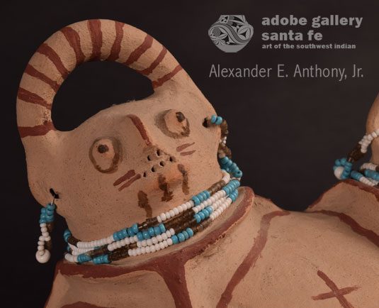 Close up view of one of the heads on this Mojave effigy jar.