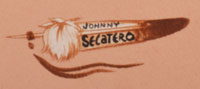 Johnny Secatero (1945 – 2010) artist signature and hallmark feather.