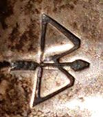 Ike Wilson (1900-1942) hallmark signature of bow and arrow symbol.