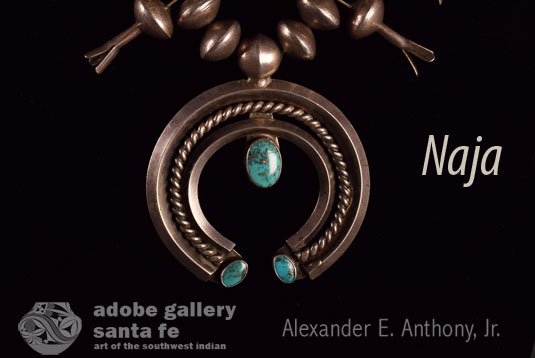 At the bottom of the necklace hangs a naja, the crescent shape borrowed from the Spanish by way of the Moors. 