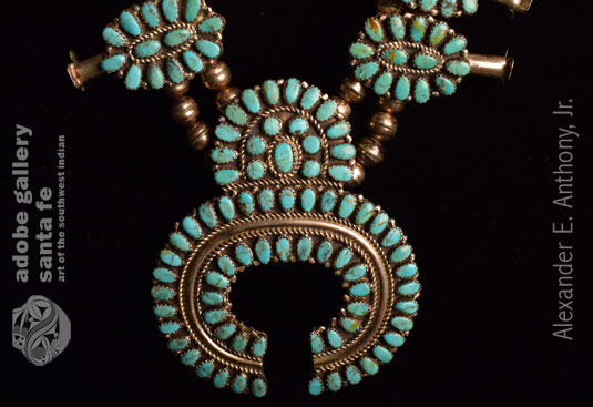 Close up view of the naja element of this necklace.