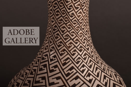 Alternate close up view of the neck designs on this pottery vase.