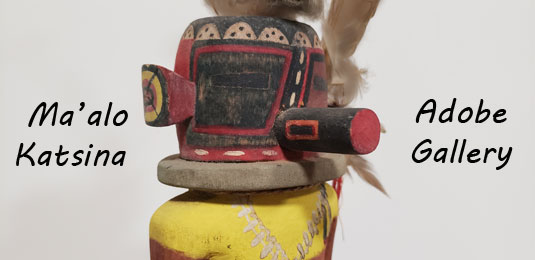 Close up view of the face of this kachina doll.