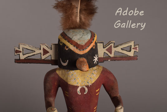 Close up view of the face of this kachina doll.