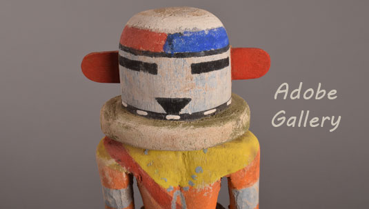 Close up view of the face of this kachina doll.