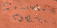 Artist Signature on one of the bear's paws.