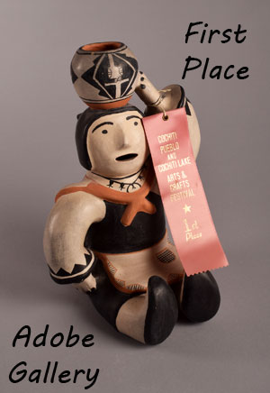 Louis Naranjo entered this figurine in the 1982 Cochiti Pueblo and Cochiti Lake Arts and Crafts Festival where it was awarded a First Place. 