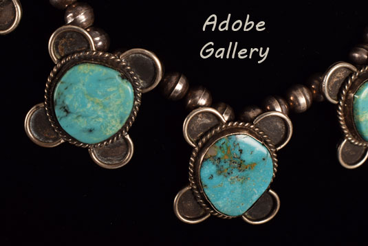 Close up view of a section of this silver and turquoise necklace