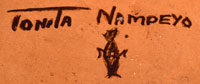 The bottom of the jar is signed “Tonita Nampeyo” and marked with her clan’s corn symbol.