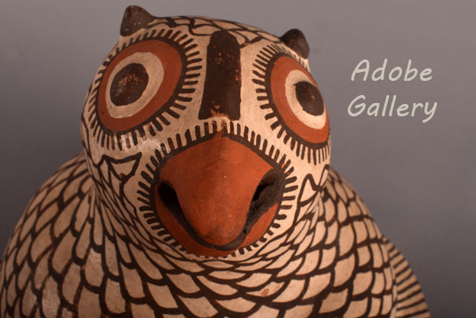 Close up view of the face of this owl figurine.