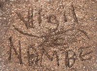 Artist Signature of Lonnie Vigil, Nambe Pueblo Potter