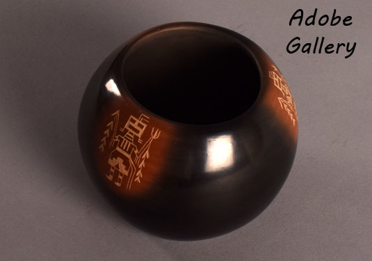 Alternate view of this black and sienna pottery jar.