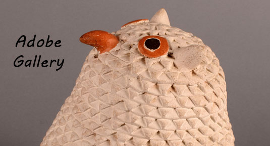 Alternate close up view of the face of the owl figurine.
