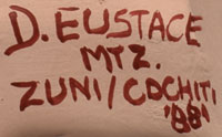 Artist signature of Denise Eustice, Zuni and Cochiti Pueblo Artist