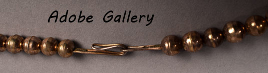 A simple hook and loop secures this necklace.