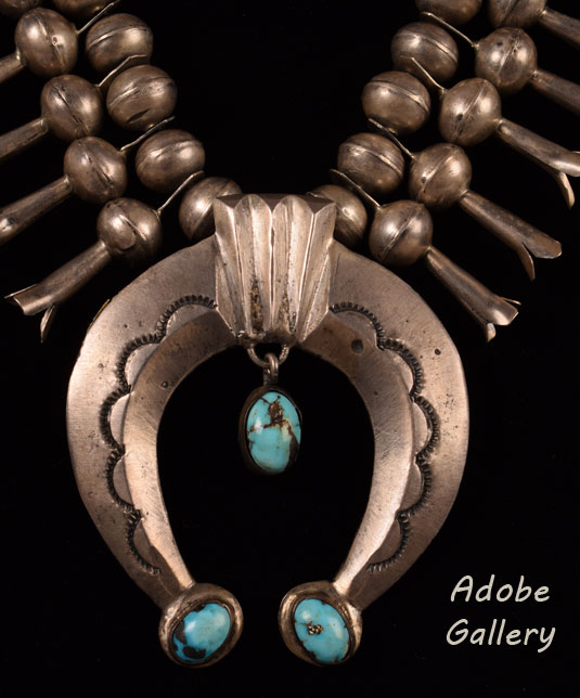What is a Naja? Early Navajo-made jewelry contained elements that were borrowed directly from Spanish colonial and Mexican ornament. One of these items is the naja, a crescent form of Moorish origin. The Spanish conquerors in the Southwest outfitted their horses in elaborate silver ornaments—one of which was the naja that hung directly on the forehead of the horse as a part of the bridle.  Today, it is still seen in both Pueblo and Navajo modern jewelry.