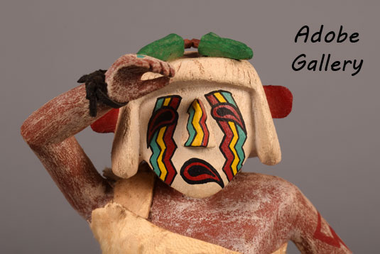 Close up view of the face of this Katsina doll.